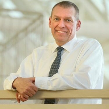husband, Rick Escher, in business attire. Photo credit: Ottawa Citizen