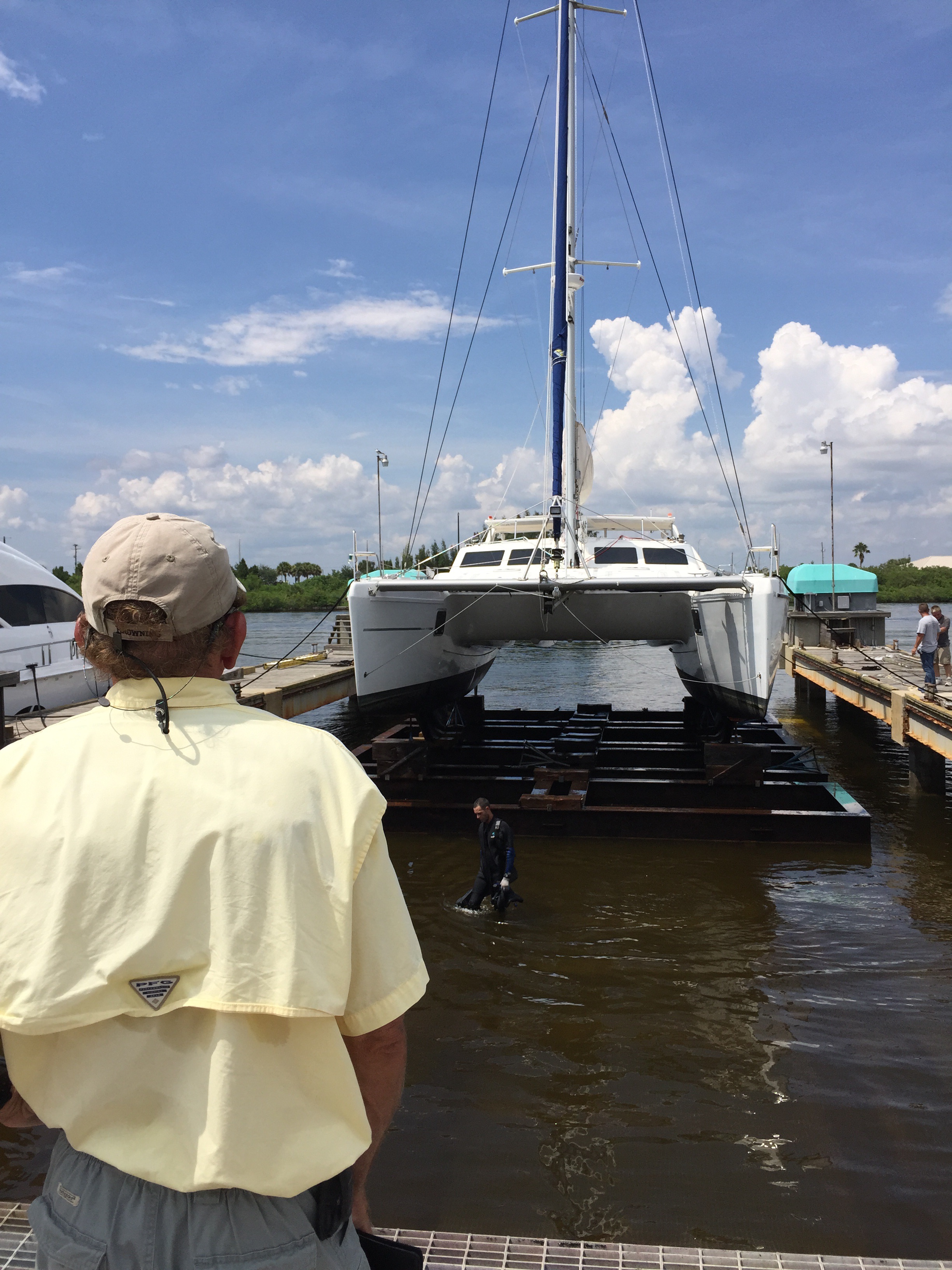 RiverHawk diver emerges from the water as marine expert and our advisor, Pat Reischmann looks on.