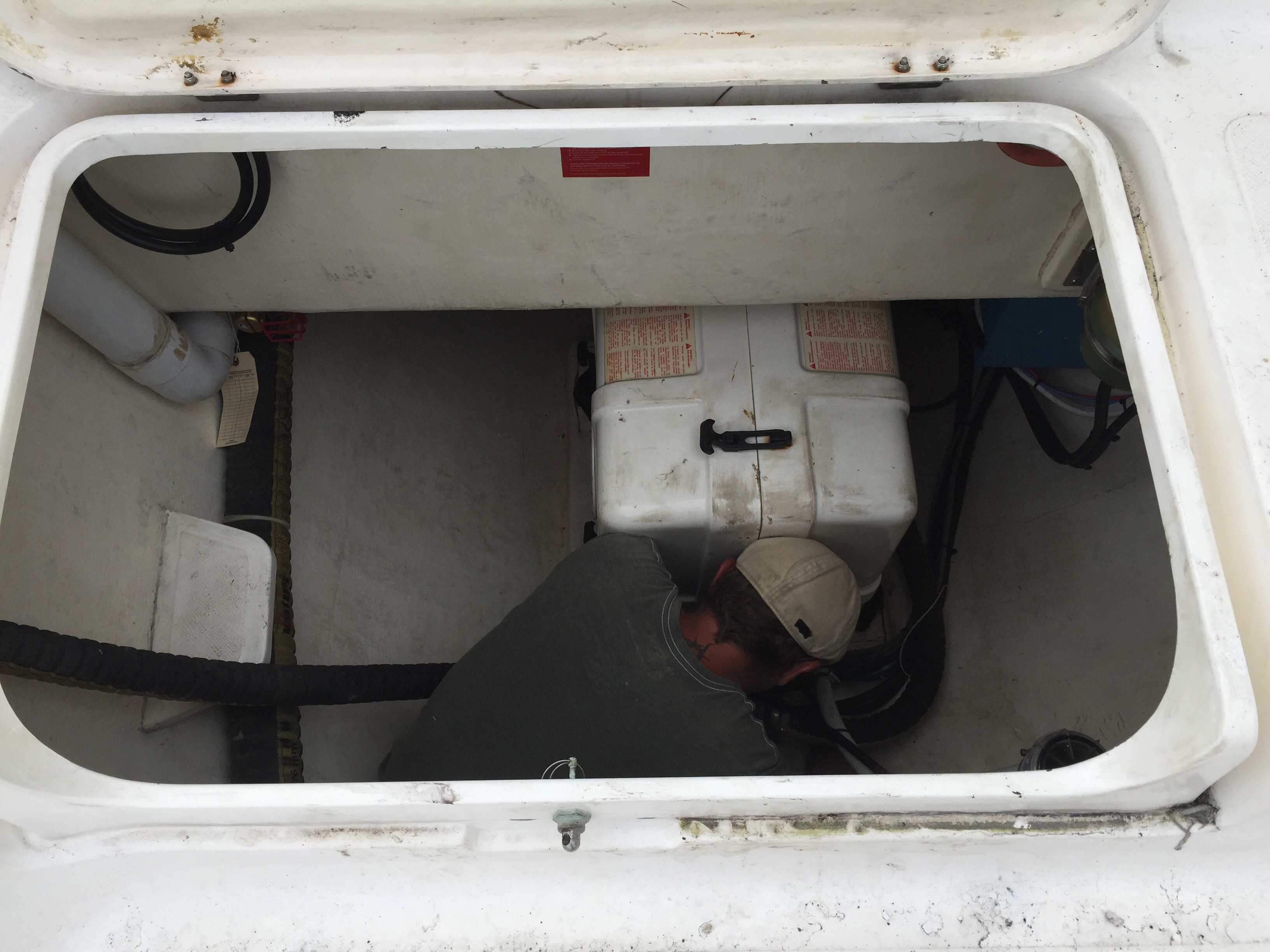 Ryan working in a locker on the aft deck of the SV Aphrodite.