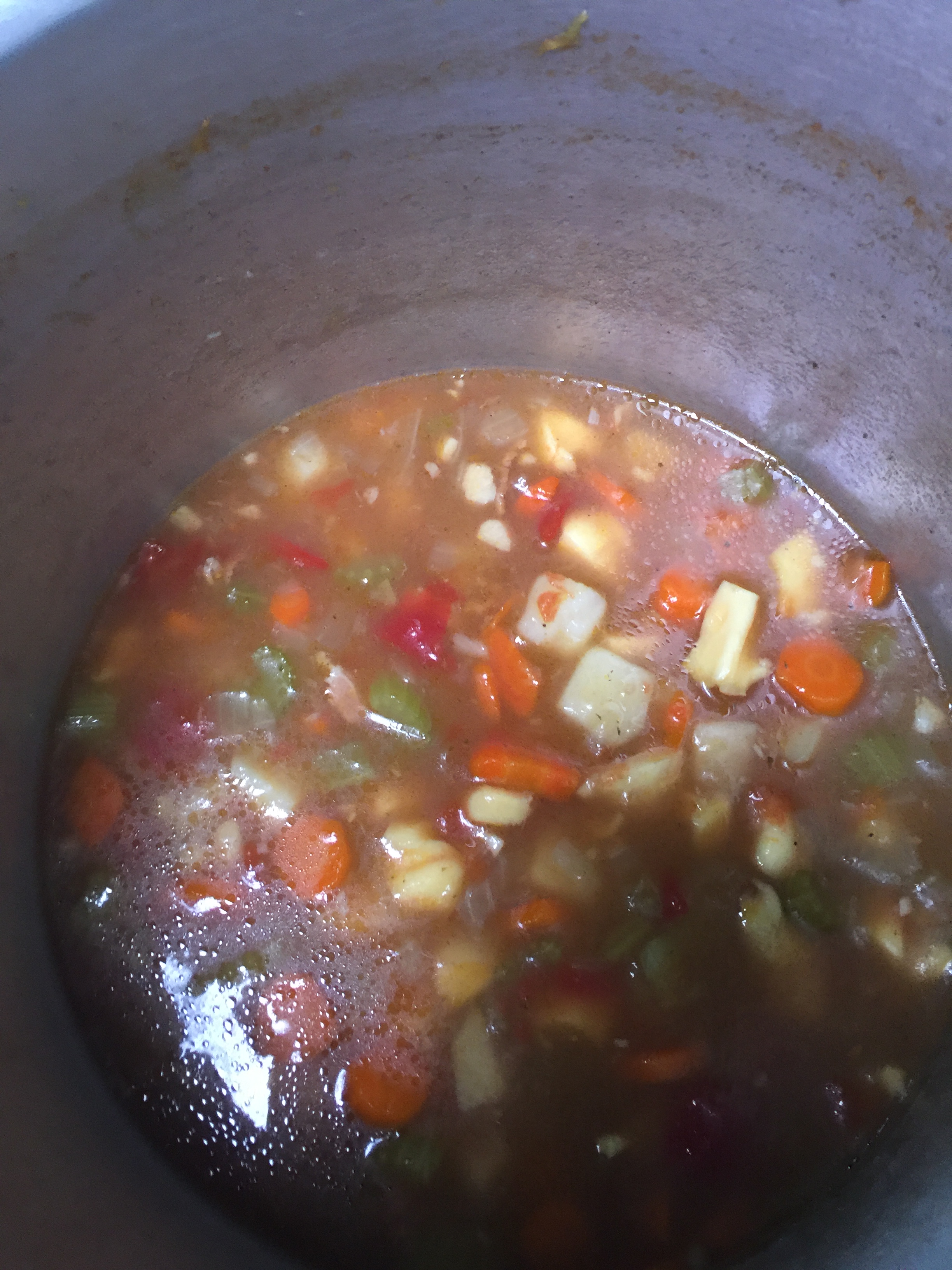 Conch chowder in a cooking pot.