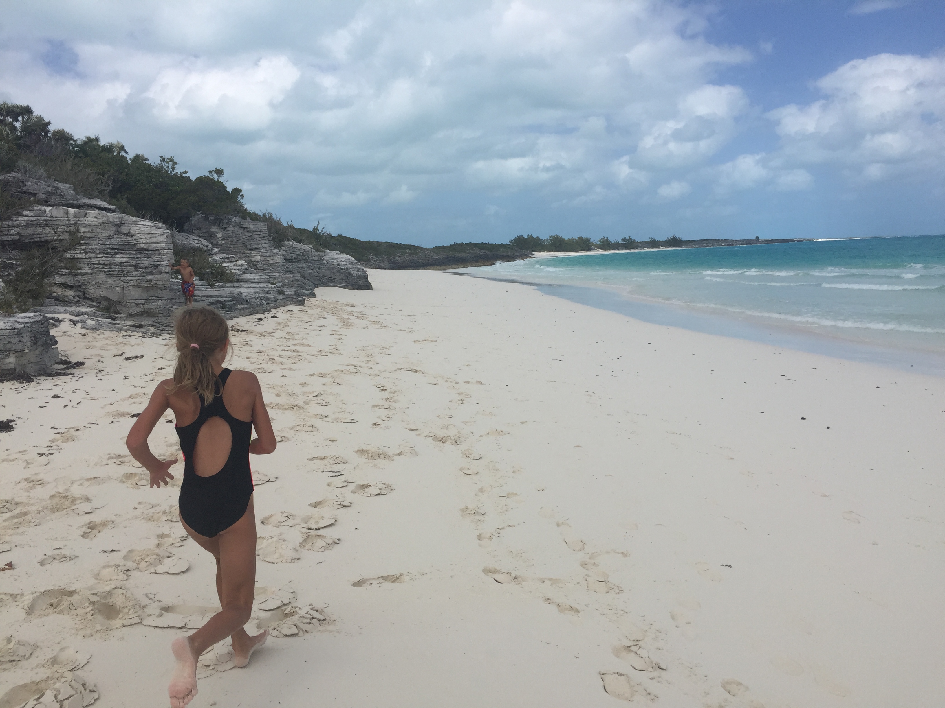 Betty runs along the beach  at Shroud Cay, Bahamas.