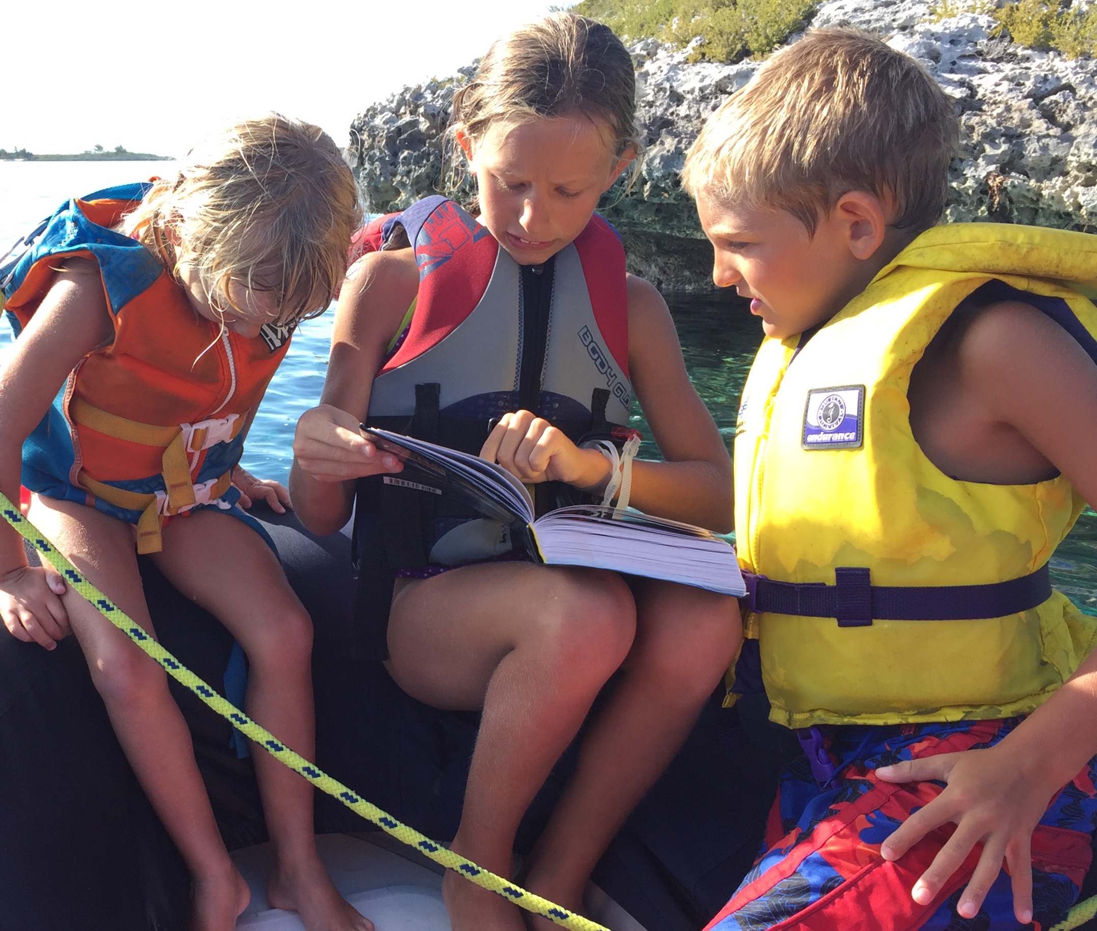 Karen, Betty, and Paul using our reef fish identification book.