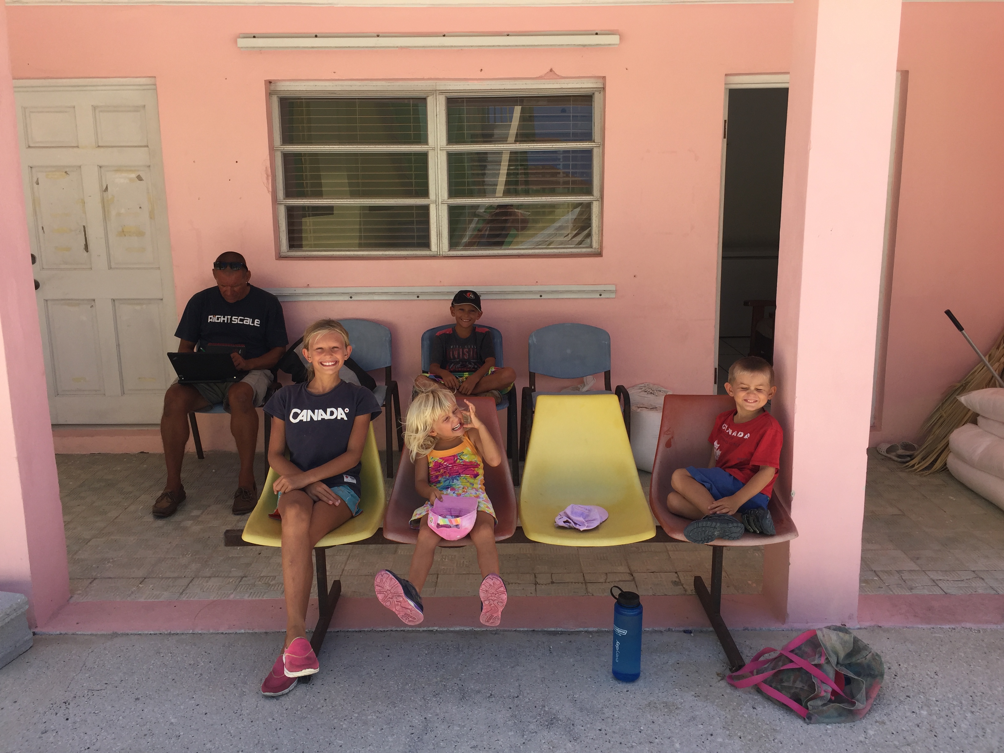 Escher family of SV Aphrodite outside the clinic in Duncan Town as of 2016. Yet, this clinic was damaged by a hurricane, which we saw in 2019