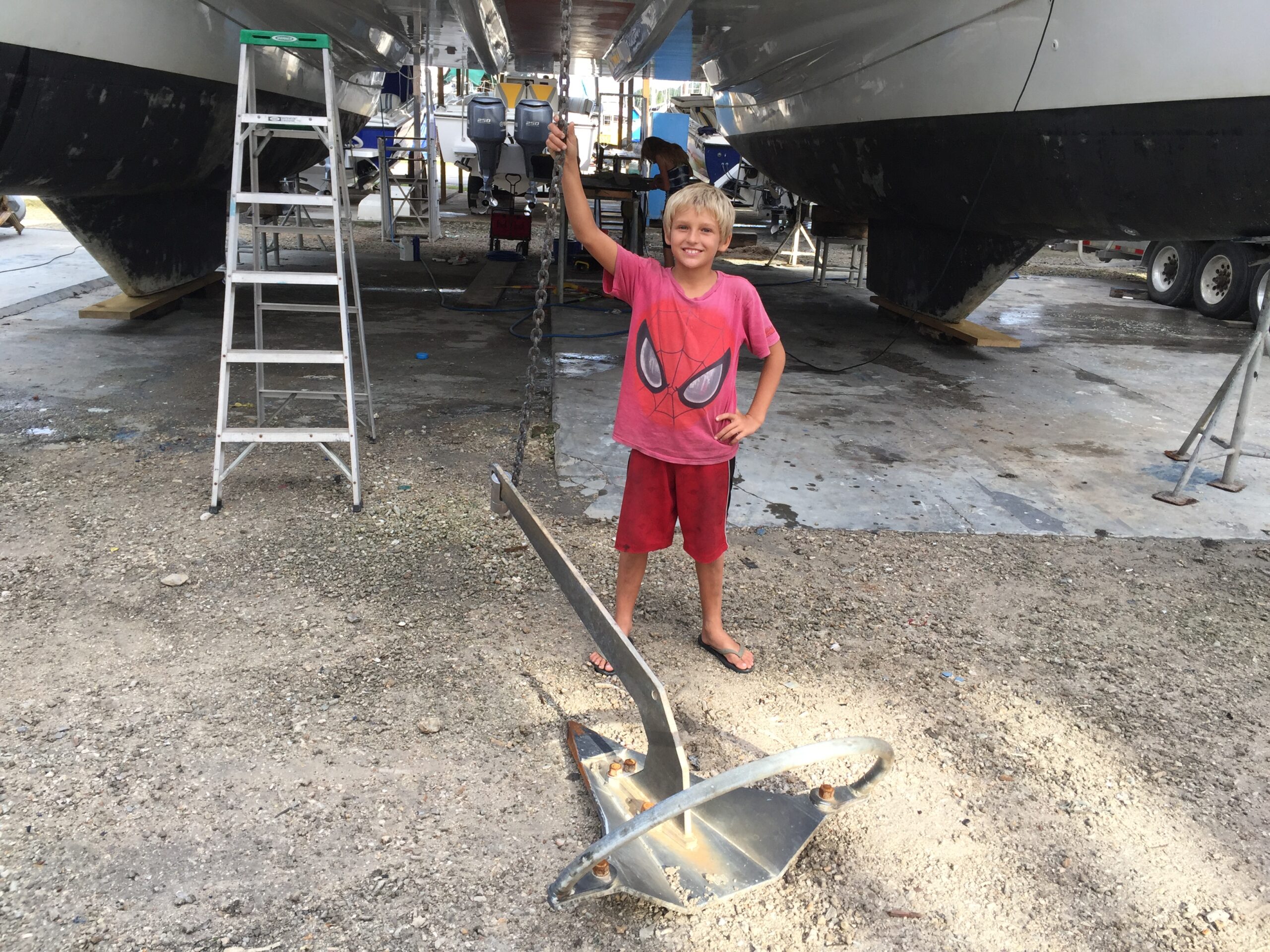 Paul in Power Boat Boatyard, Chaguaramas, Trinidad with our Mantus Anchor 2017 below SV Aphrodite, our St Francis 50 catamaran.