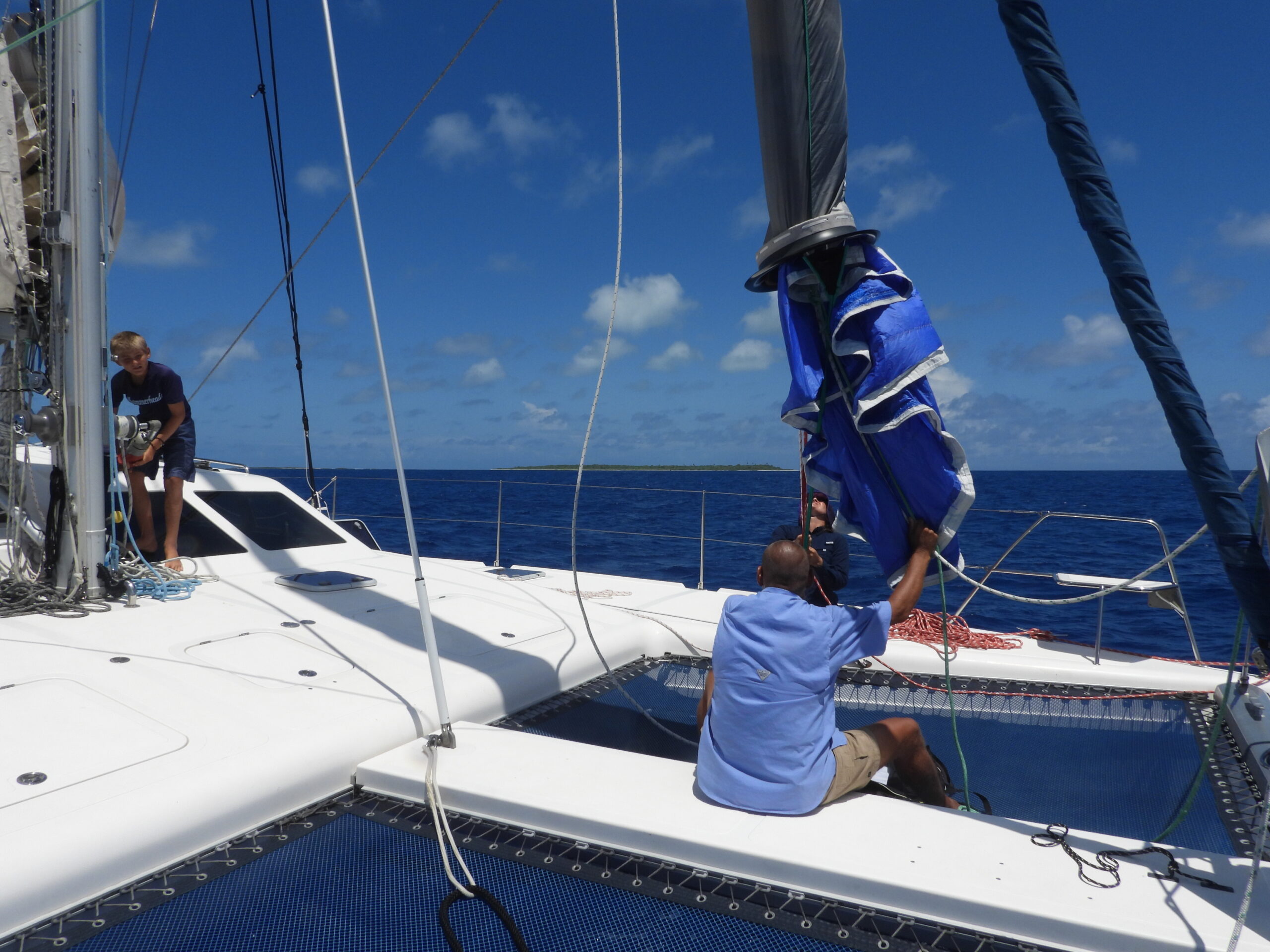 Putting the Parasailor back in the "sock" on SV Aphrodite, a St Francis 50 catamaran.