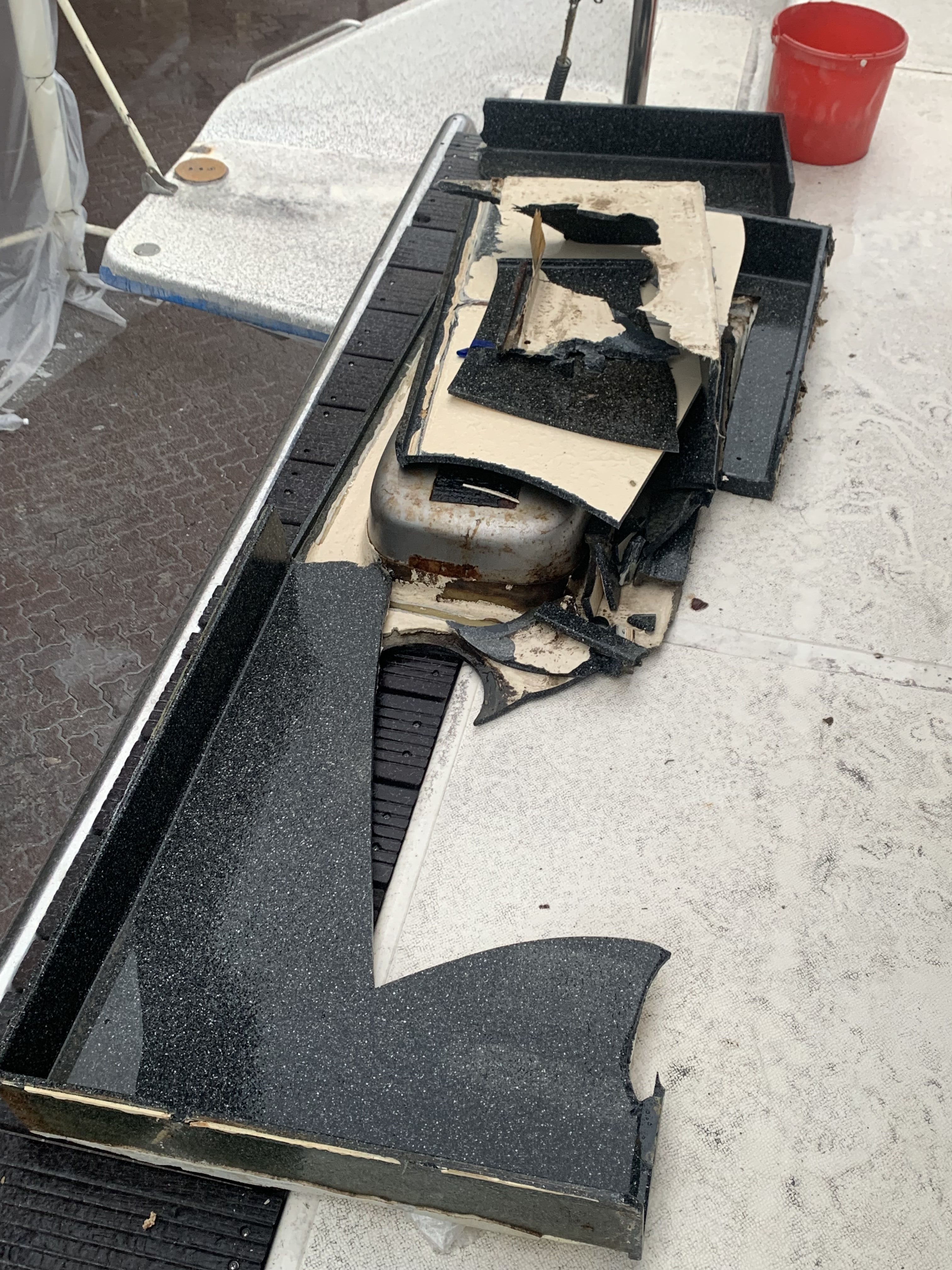 Our original Corian countertop and old sinks lie on the back transom of our boat.