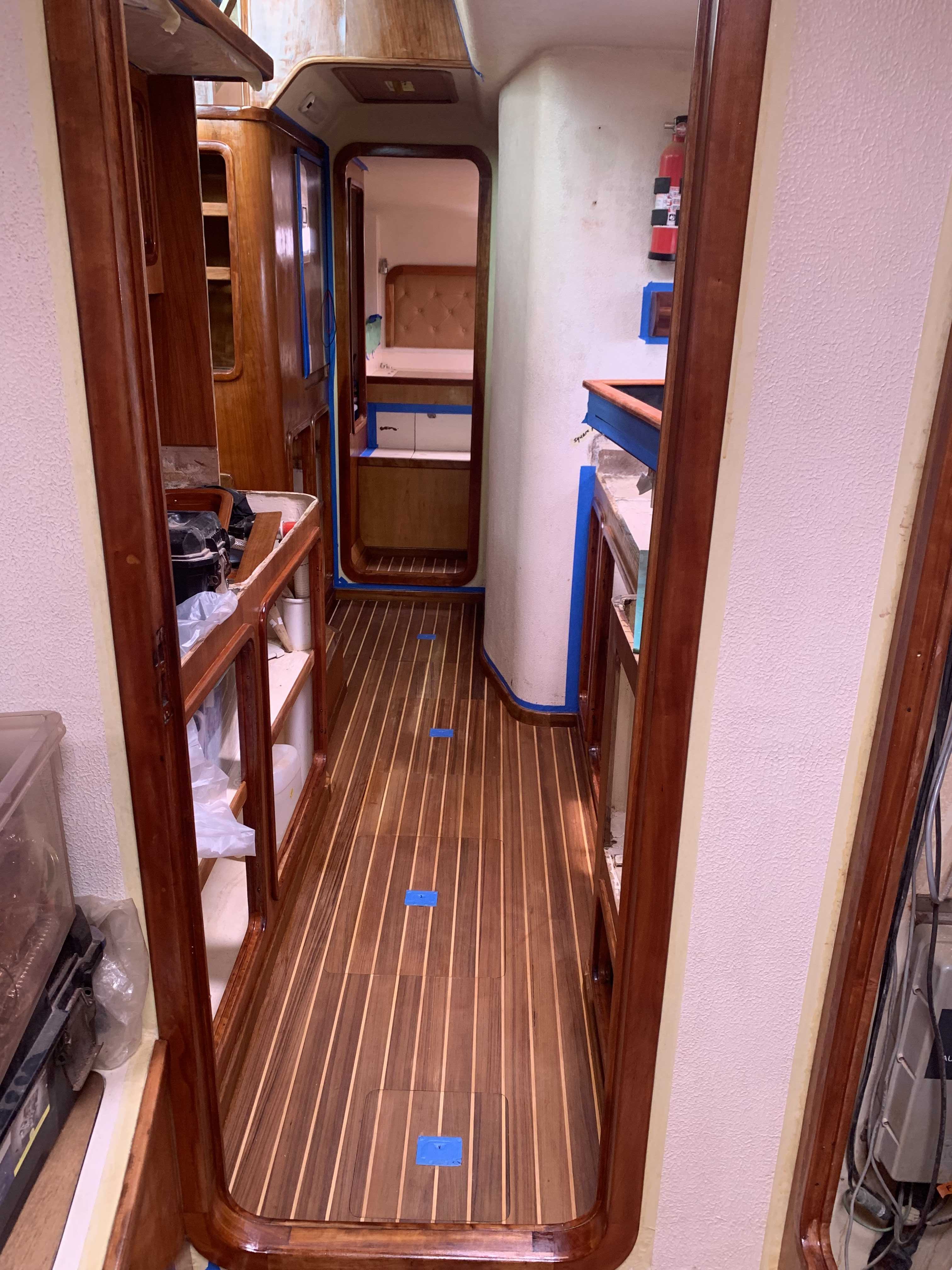 Shows Eastbay preparation work to add varnish to the galley of SV Aphrodite, a St Francis 50 catamaran.