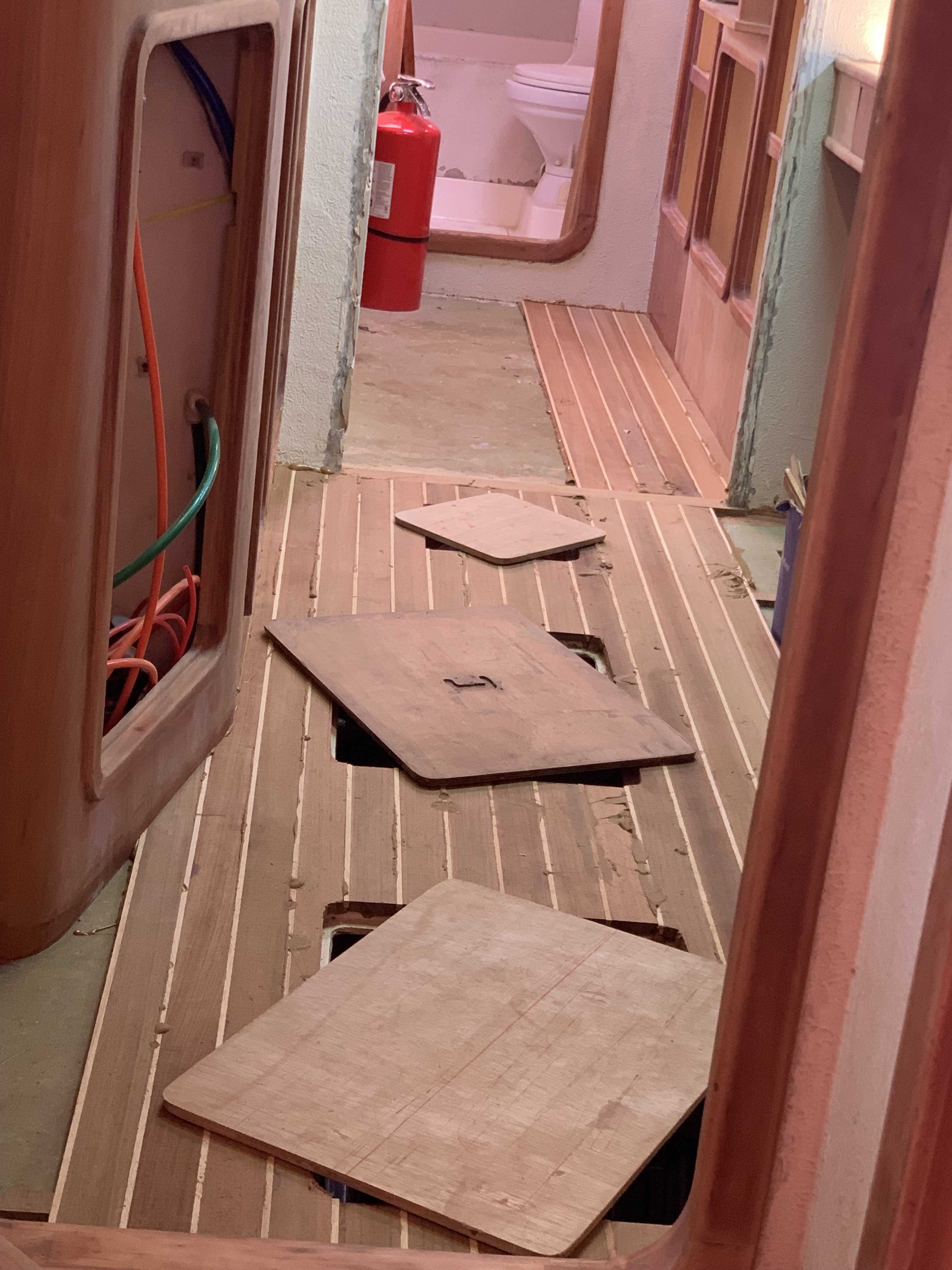 Starboard flooing installation in progress during the woodwork refit on SV Aphrodite, a St Francis 50 catamaran.