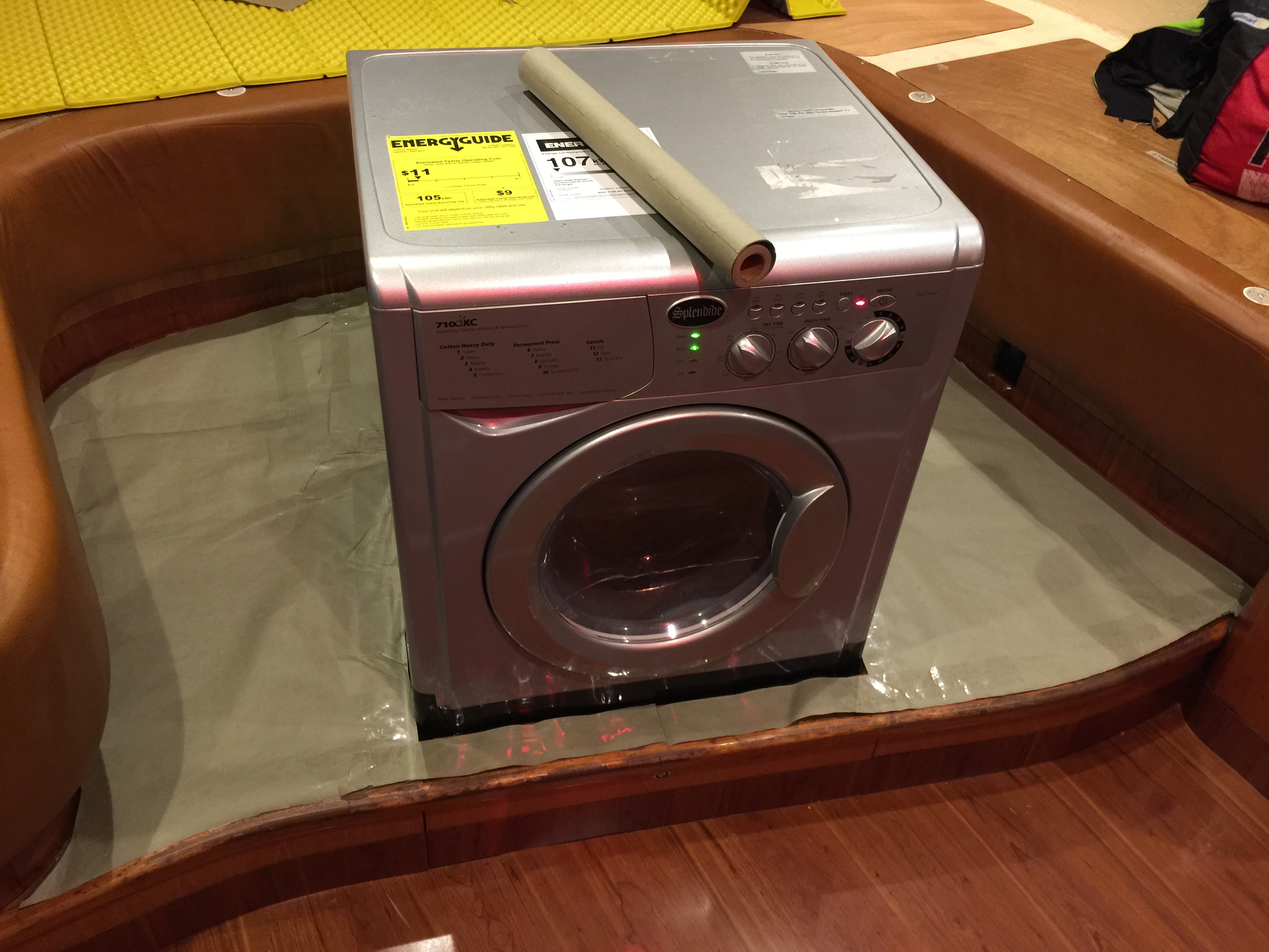 Our Splendide 7100XC washer/dryer surrounded by a brown paper template.
