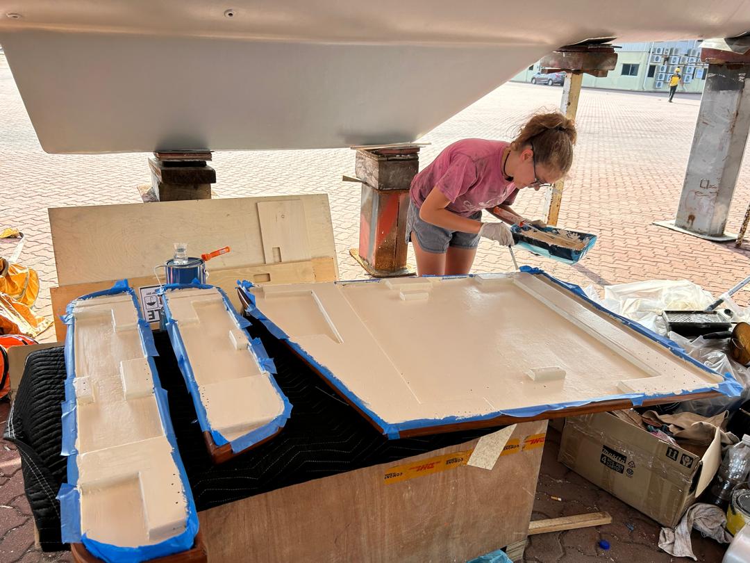 Karen painting the underside of our saloon table
