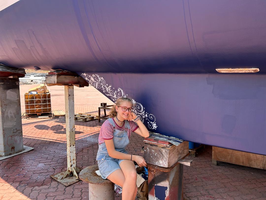 Karen Escher painting the keel in Langkawi, Malaysia.