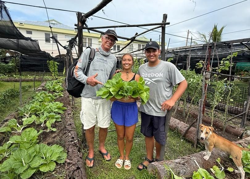 Dave, Hali and Paul in French Polynesia with fresh produce